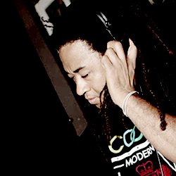 Jordan Fields DJing with headphones